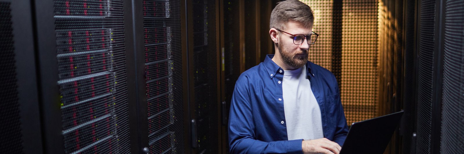 Header Image of IT Technician Managing Network Server Room